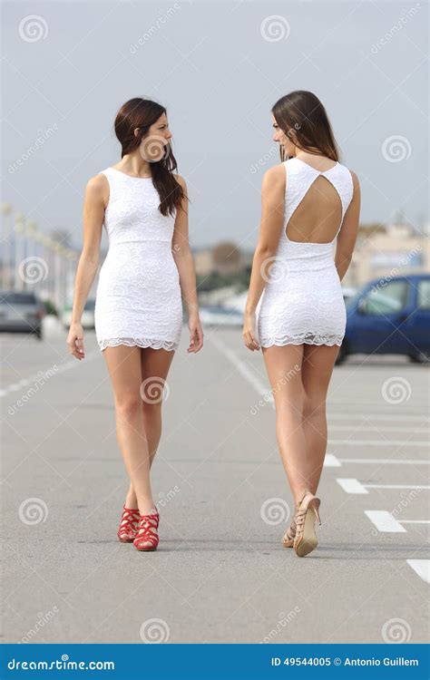 Two Women With The Same Dress Looking Each Other With Hate Stock Image