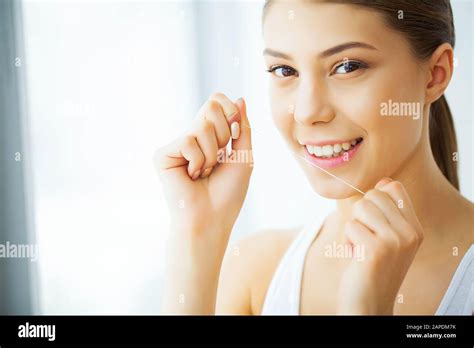 Health And Beauty Beautiful Young Girl With White Teeth Cleans Teeth