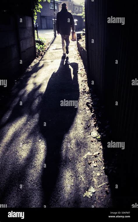 Man Walking Down Alley Stock Photo Alamy