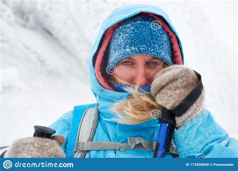Portrait Of A Woman Hiking In Snowy Weather On Frosty Day Stock Image