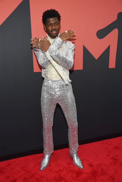The rapper has already unveiled his satan shoes. as if the name itself wasn't enough, these shoes also contain human blood. Lil Nas X Owned the VMAs Red Carpet in a Sequined Suit and Silver Cowboy Boots - Celebrity