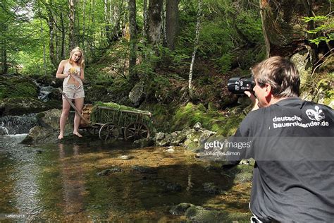 Photographer Stefan Soell Works With Model Gina During The Making Of