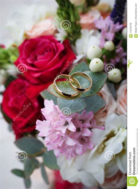 Wedding Bouquet With Rings On It Close Up Stock Photo