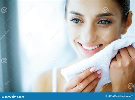 Health And Beauty Beautiful Young Girl With White Teeth Holding Stock