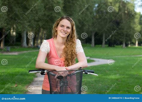 Woman On A Bike In A Park Stock Photo Image Of Nature