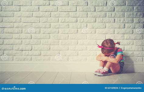 Little Child Girl Crying And Sad About Brick Wall Stock Photo Image