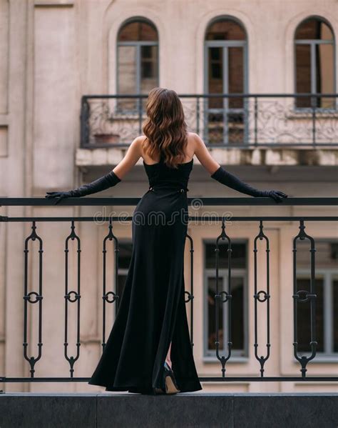 Mysterious Silhouette Of An Elegant Retro Woman A Lady In Long Black Evening Dress Stands On