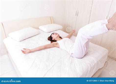 Happy Woman Lie Down On Her Bed Stock Image Image Of Lazy Blanket