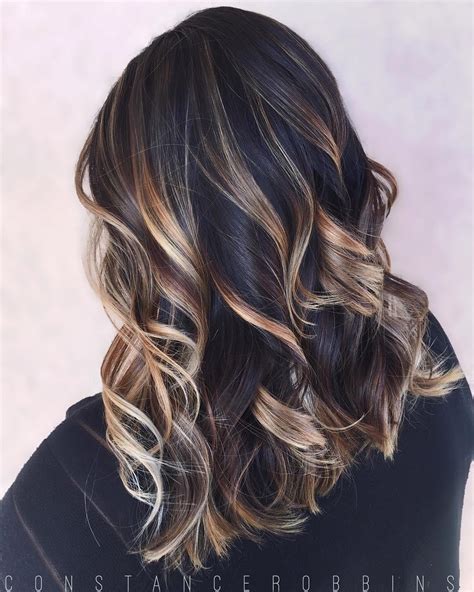 Auburn balayage highlights can look absolutely natural on black hairs while adding a fresh look to them. Black Hair With Blonde Highlights For 2020 - Pretty Designs