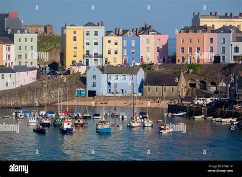 Tenby Harbour With Boats At High Tide At Sunset Tenby Dinbych Y Pysgod