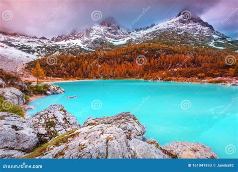 Misty Mountains With Turquoise Alpine Glacier Lake Sorapis Dolomites