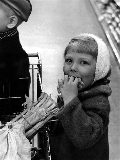 Girl Eating In Grocery Store Circa 1960 Black Photograph By Mark Goebel