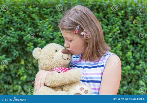 Little Girl Holding Large Teddy Bear Outside Stock Photo Image Of