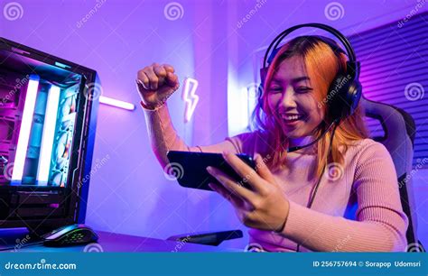 Happy Gamer Playing Video Game Online With Smartphone She Raises Hands
