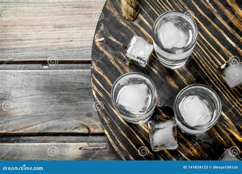 Vodka In A Shot Glass And Ice Cubes On Tray Stock Image Image Of