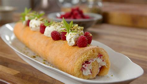 Place the top half back on and sprinkle with icing sugar. James Martin Swiss roll with raspberry jam recipe on James ...