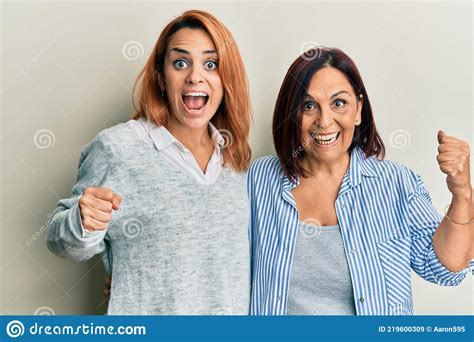 Latin Mother And Daughter Wearing Casual Clothes Screaming Proud Celebrating Victory And