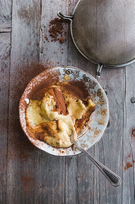 Overhead Shot Of Tiramisu Dessert With Cocoa Powder By Alessio Bogani