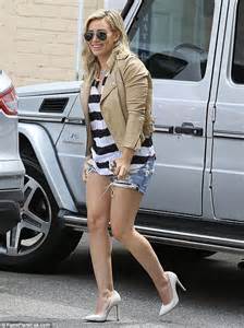 Hilary Duff Shows Off Her Athletic Pins In A Pair Of White Pumps While
