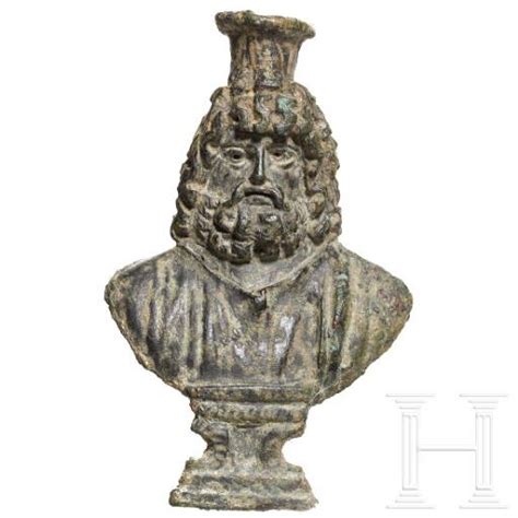 A Roman Bronze Fitting In The Shape Of A Serapis Bust 1st 2nd