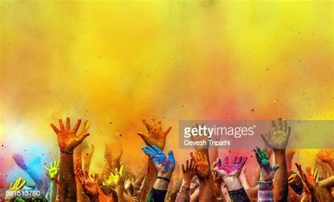 Hands Painted With Different Colors Raised Up On Holi Festival