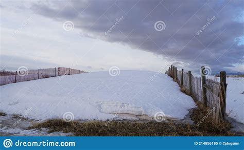 A Large Drift Of Snow On A Snow Fence In Wyoming Stock Image Image