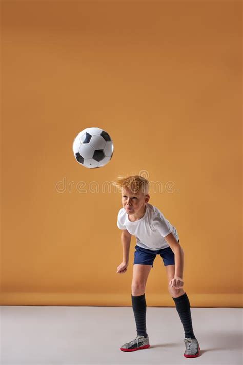 Kid Boy Kicking Soccer Ball On Sports Field Stock Photo Image Of Kick