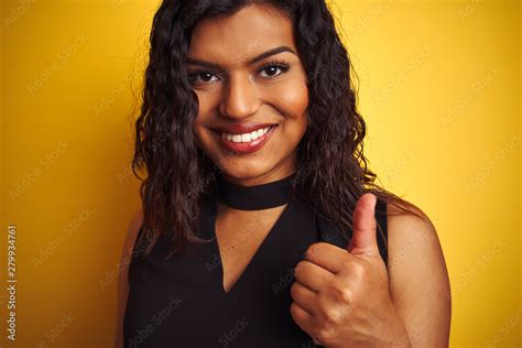 Transsexual Transgender Woman Wearing Black T Shirt Over Isolated Yellow Background Happy With