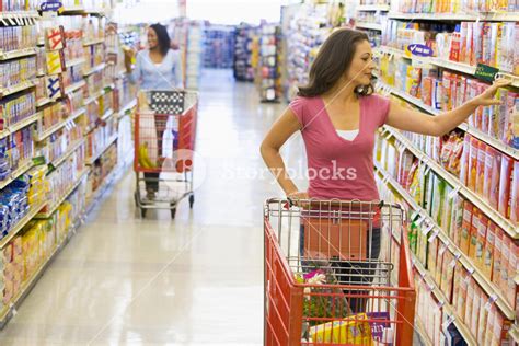 women grocery shopping in supermarket royalty free stock image storyblocks