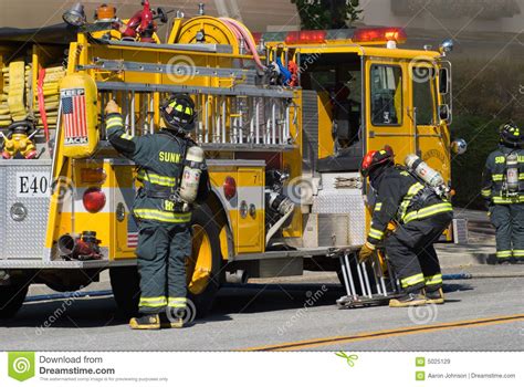 Yellow Fire Truck And Firefighters Royalty Free Stock