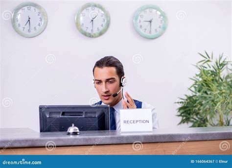 Young Man Receptionist At The Hotel Counter Stock Image Image Of