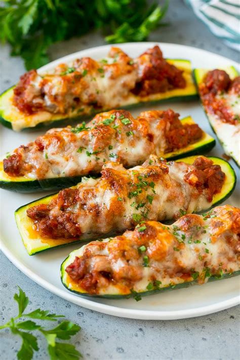 Stuffed zucchini boats are filled with goat cheese, parmesan and marinara, then baked. Stuffed Zucchini Boats - Dinner at the Zoo