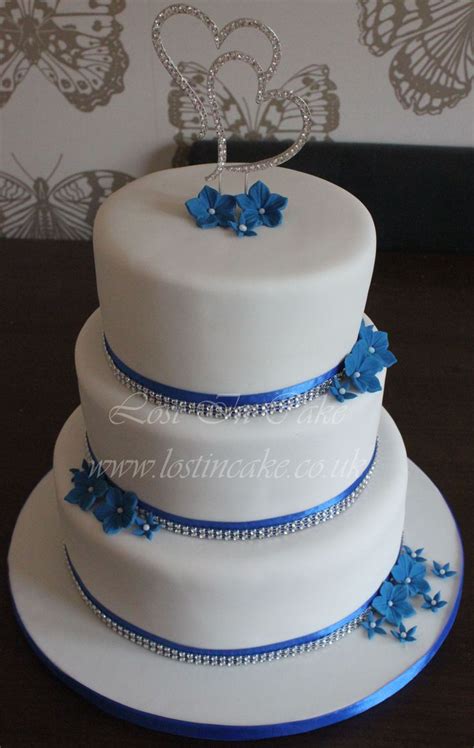 White And Royal Blue Wedding Cake With Diamante Trim Topper And