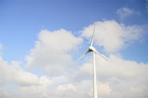 Wind Turbine Against Blue Sky Stock Photo Image Of Engineering Beach