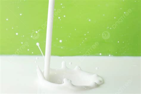 Pouring Milk Splash Pouring Milk Splash On Green Background Close Up