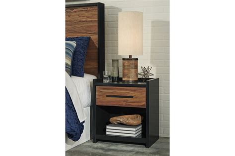 Stavani One Drawer Night Stand In Black And Brown By Ashley