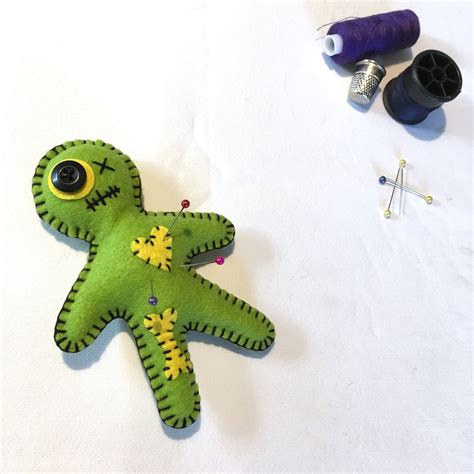 hand embroidered voodoo doll pin cushion green juju doll etsy pin doll pin cushions voodoo