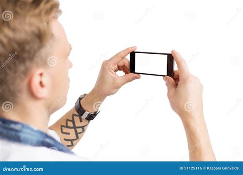 Young Man Taking Photo With Mobile Phone Isolated On White Background