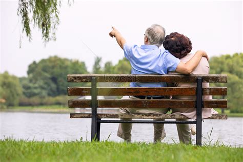 Elderly Couple Sitting On Park Chair Back View Picture And Hd Photos