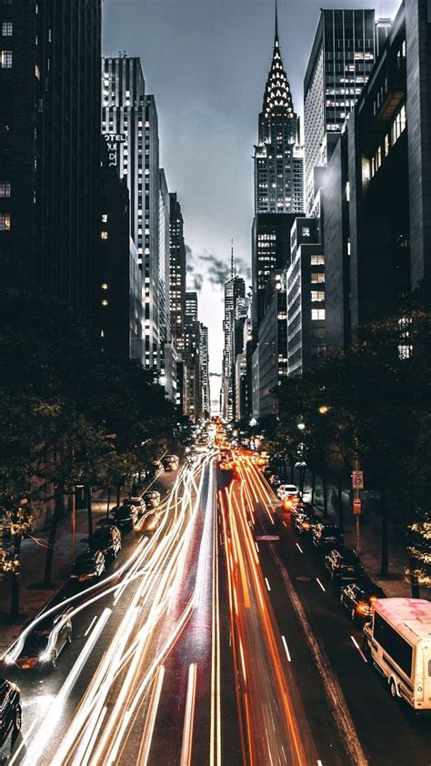 A City Street Filled With Lots Of Traffic At Night