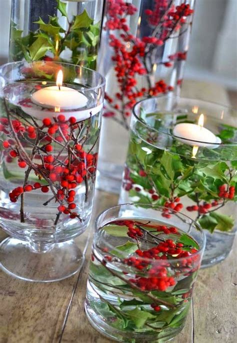 Easy Holly Centerpiece In A Glass Vase With Floating Candles Diy Holiday Candles Christmas