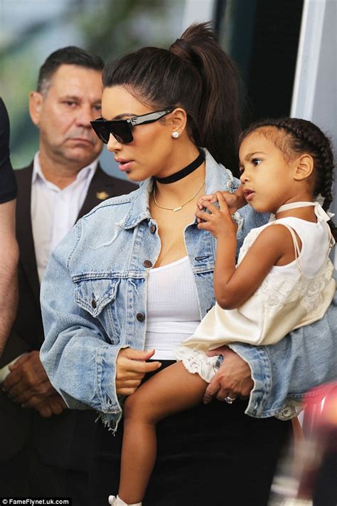 Kim Kardashian Holds Daughter North West Tight As They Attend Church In