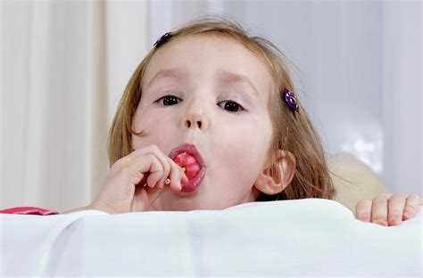Girl Eating A Lollipop Photograph By Lea Paterson Science Photo Library
