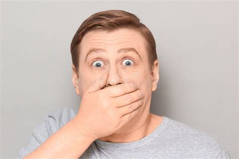 Portrait Of Shocked Frightened Man Covering Mouth With Hand Stock Image Image Of Dumbfounded