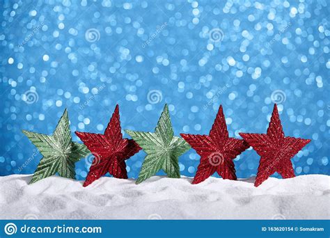 Glitter Stars In Snow Blue Background Stock Photo Image
