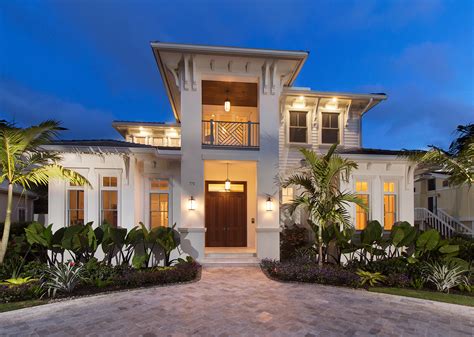 South Florida Design Front Elevation At Dusk Of A Tan Contemporary 2