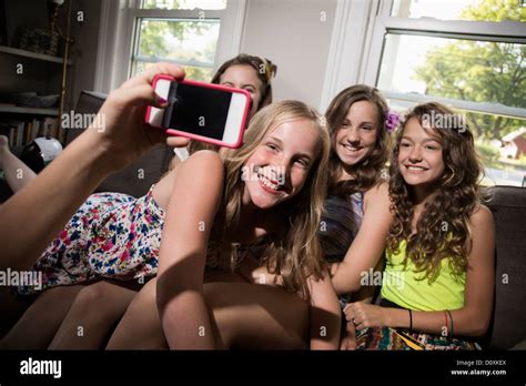 Group Of Girls Being Photographed With Camera Phone Stock Photo Alamy