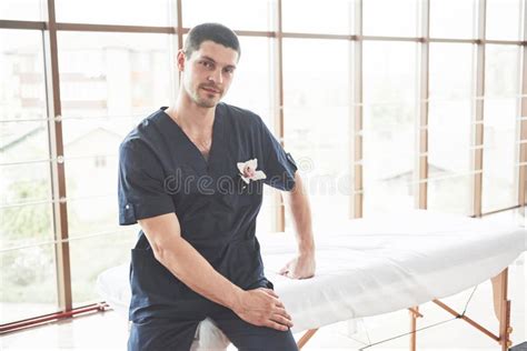 Man Is A Masseur Standing At The Massage Table In The Cabin Stock Image Image Of