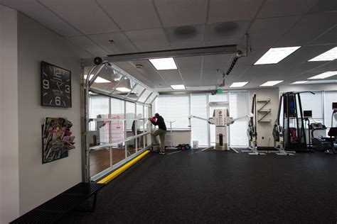 Garage Door Separating Class Space And Open Floor Gym For Flexibility