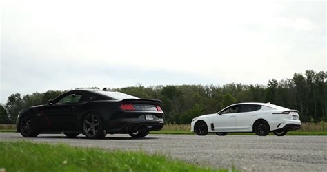 Watch This Tuned Kia Stinger Gt Take On A Mustang Gt Roush 50